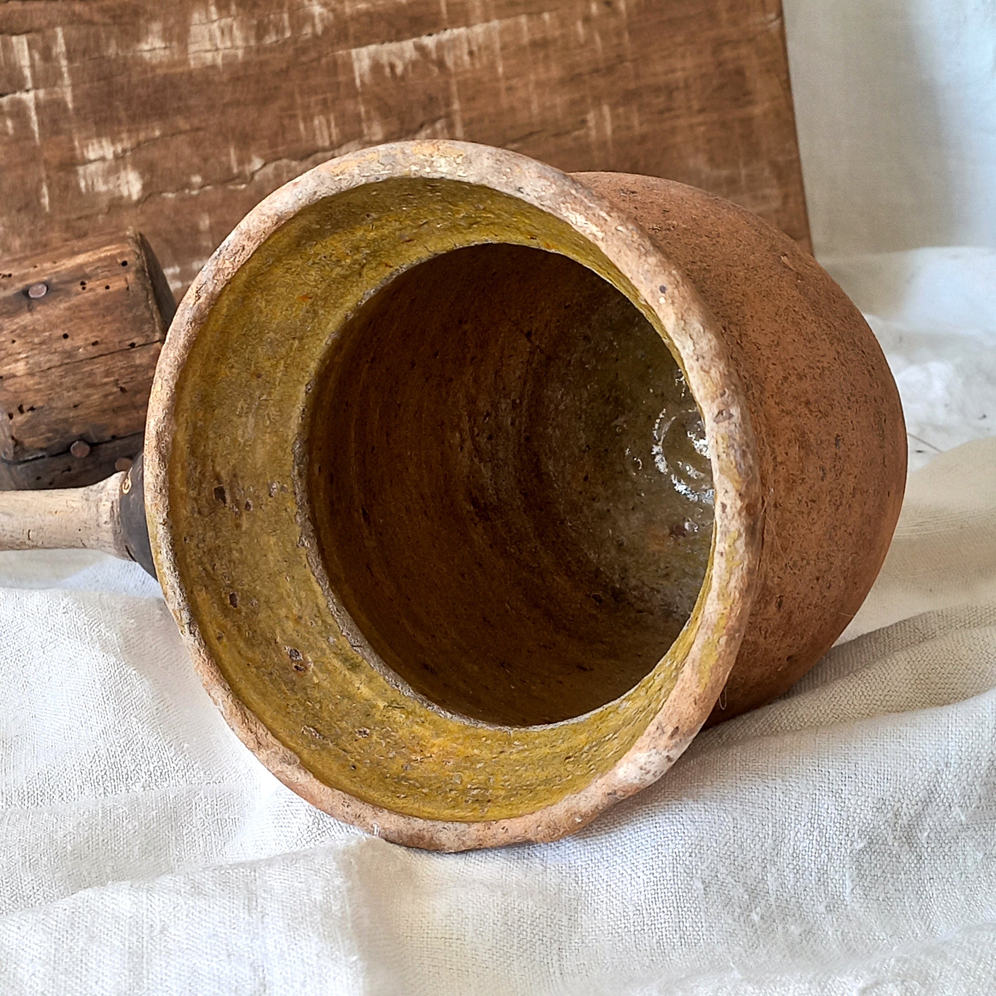 A little antique stoneware jug with a glazed interior in a wonderful shade of ochre, so rustic! This piece of pottery has aged beautifully and with its uneven worn edges and earthy rough texture it's perfect for a rustic, country or farmhouse interior.