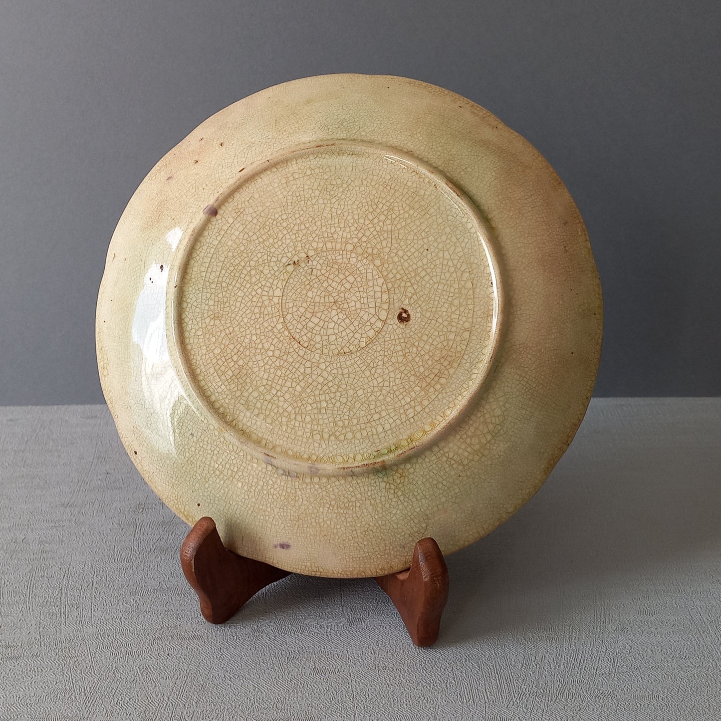 Small and beautiful French antique crazed majolica plate with a wonderful colour scheme depicting dark purple grapes and green foliage; this wonderful old plate will make an excellent addition to a collection or as a stand-alone display piece.