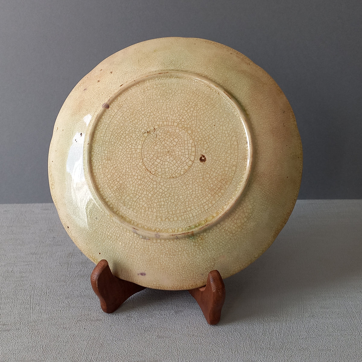 Small and beautiful French antique crazed majolica plate with a wonderful colour scheme depicting dark purple grapes and green foliage; this wonderful old plate will make an excellent addition to a collection or as a stand-alone display piece.