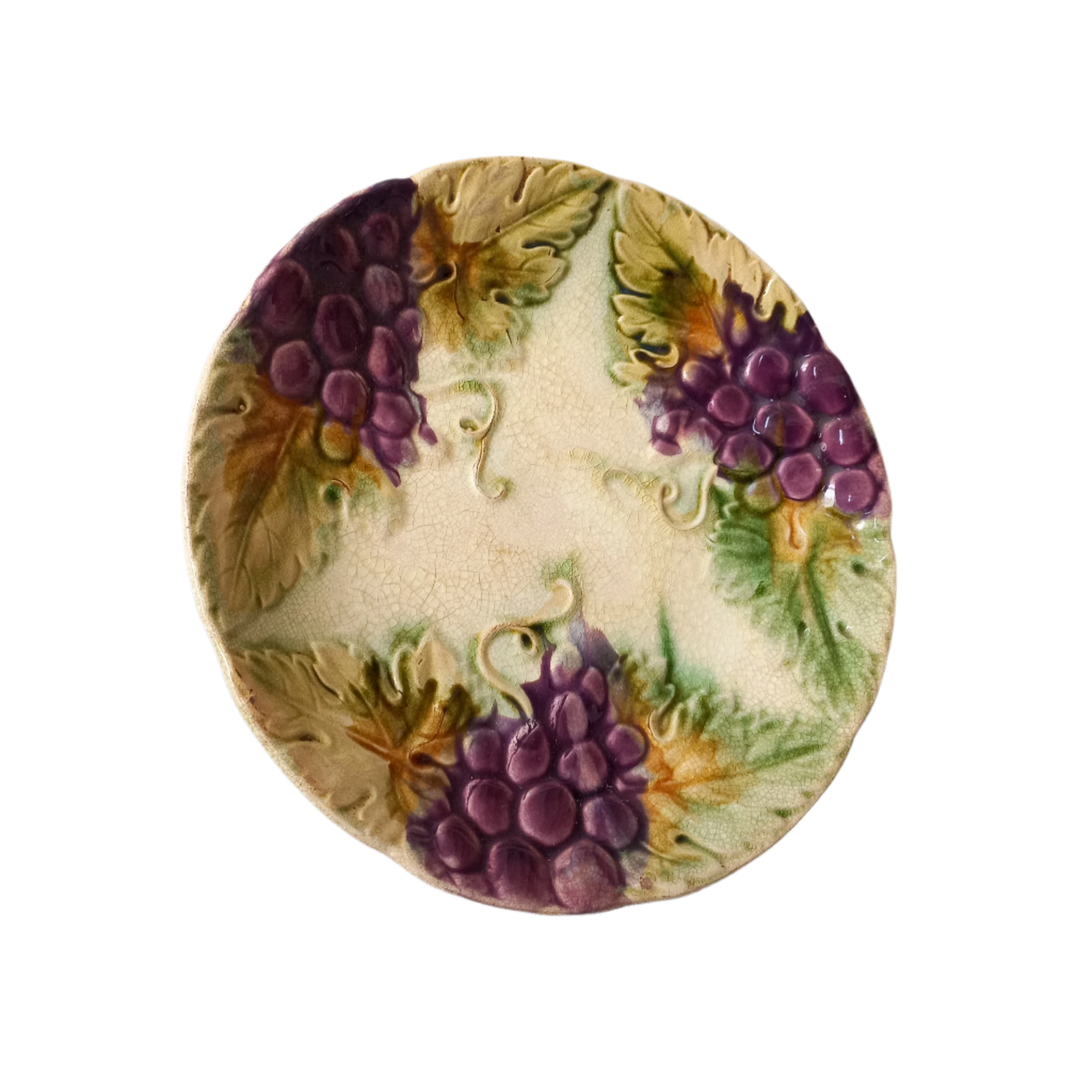 Small and beautiful French antique crazed majolica plate with a wonderful colour scheme depicting dark purple grapes and green foliage; this wonderful old plate will make an excellent addition to a collection or as a stand-alone display piece.
