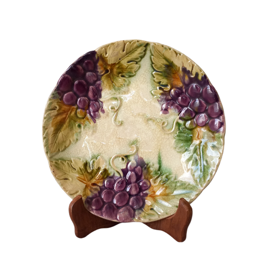 Small and beautiful French antique crazed majolica plate with a wonderful colour scheme depicting dark purple grapes and green foliage; this wonderful old plate will make an excellent addition to a collection or as a stand-alone display piece.