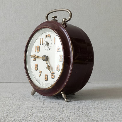 A handsome little vintage alarm clock by premier French manufacturer, Jaz.

This wonderful little clock is in semi-working condition including the alarm, although I should note that being an old time piece dating from the pre-1940 period he's temperamental and sometimes will just stop working, although all that's needed is a gentle shake from side to side and he will once more begin to tick - sometimes you might have to repeat this and have patience with him.
