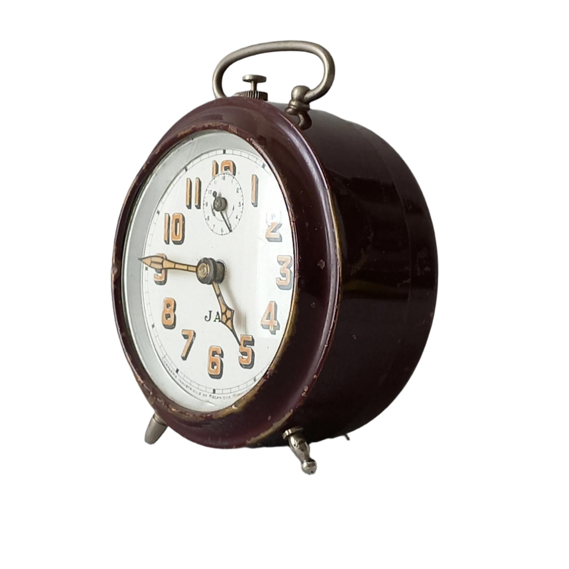 A handsome little vintage alarm clock by premier French manufacturer, Jaz.

This wonderful little clock is in semi-working condition including the alarm, although I should note that being an old time piece dating from the pre-1940 period he's temperamental and sometimes will just stop working, although all that's needed is a gentle shake from side to side and he will once more begin to tick - sometimes you might have to repeat this and have patience with him.