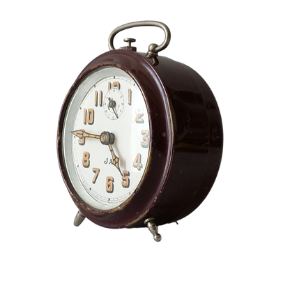 A handsome little vintage alarm clock by premier French manufacturer, Jaz.

This wonderful little clock is in semi-working condition including the alarm, although I should note that being an old time piece dating from the pre-1940 period he's temperamental and sometimes will just stop working, although all that's needed is a gentle shake from side to side and he will once more begin to tick - sometimes you might have to repeat this and have patience with him.