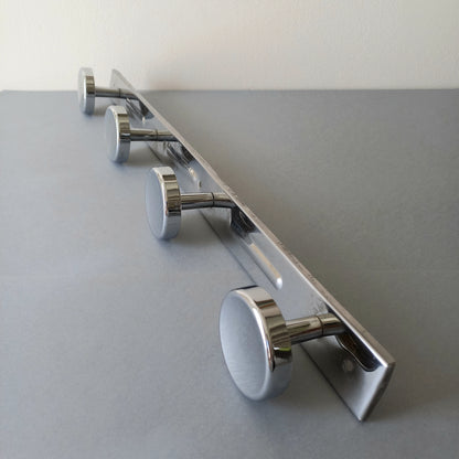 A stylish French vintage 4 peg metal coat rack with a polished finish, a great piece of practical wall decor for your home.
