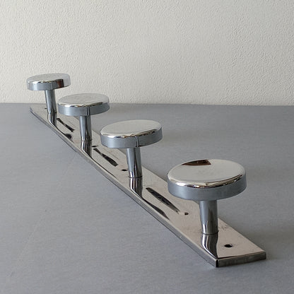A stylish French vintage 4 peg metal coat rack with a polished finish, a great piece of practical wall decor for your home.