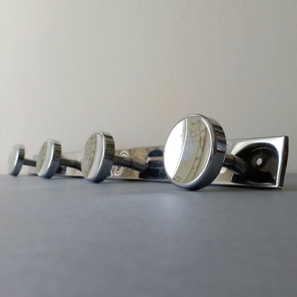 A stylish French vintage 4 peg metal coat rack with a polished finish, a great piece of practical wall decor for your home.