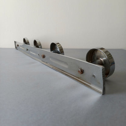 A stylish French vintage 4 peg metal coat rack with a polished finish, a great piece of practical wall decor for your home.