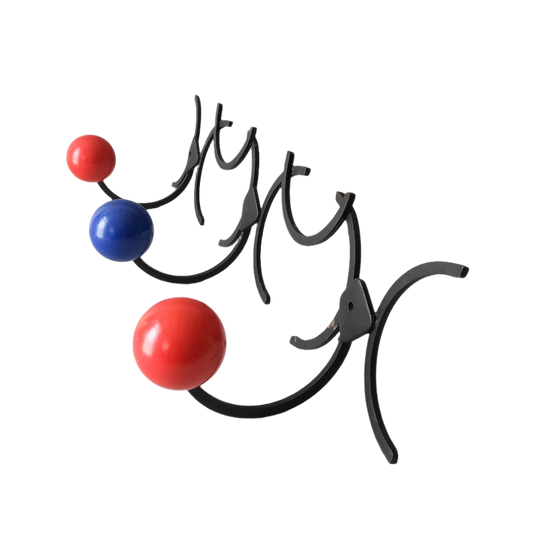 An original French vintage mid-century 'atomic' coat rack, a rare find these days and a wonderful piece of practical home decor. The black frame-work that holds the coloured pegs/balls is made from strong cast iron and there are two screw holes so that you can immediately fix the coat rack to your wall.