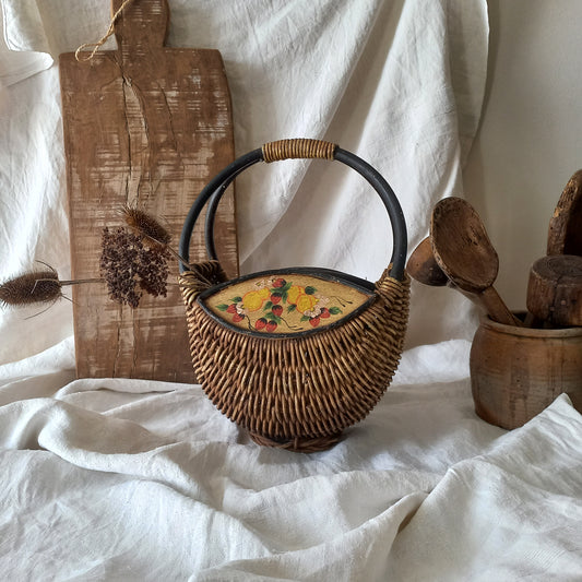 A vintage wicker shopping basket with a small wooden panel on each side with hand-painted fruit - so pretty!

This hand-made piece is full of rustic charm and offers many decorative possibilities to any interior, particularly those of a country, rustic or farmhouse nature.