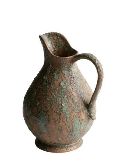 An artisan-made vintage pottery pitcher or jug that purchased in south west France. This piece is wonderful in its earthy tones of brown with a green pattern in relief all over the pitcher and would make a great piece of home decor or addition to a pottery/stoneware collection.