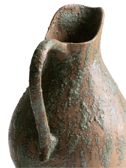 An artisan-made vintage pottery pitcher or jug that purchased in south west France. This piece is wonderful in its earthy tones of brown with a green pattern in relief all over the pitcher and would make a great piece of home decor or addition to a pottery/stoneware collection.