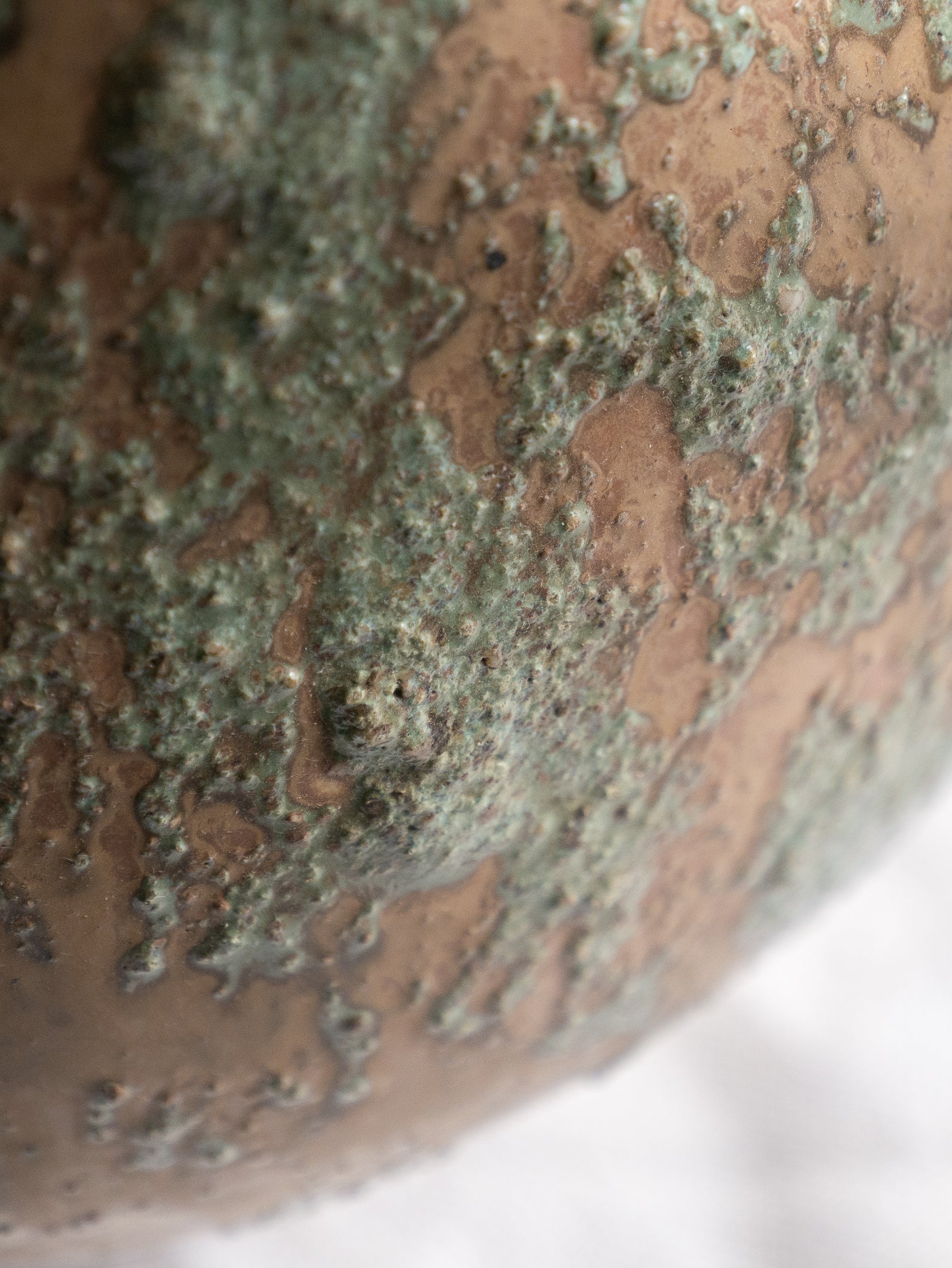 An artisan-made vintage pottery pitcher or jug that purchased in south west France. This piece is wonderful in its earthy tones of brown with a green pattern in relief all over the pitcher and would make a great piece of home decor or addition to a pottery/stoneware collection.