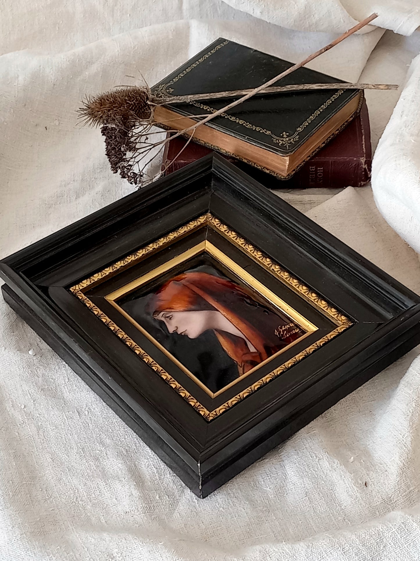 A French vintage religious enamel Saint Fabiola portrait painting by Limoges of France. The religious figure has been hand-painted in enamels on copper and signed by the artist. The art is presented in a dark brown frame with a label to the rear that tells us it's a genuine hand-made enamel artwork.