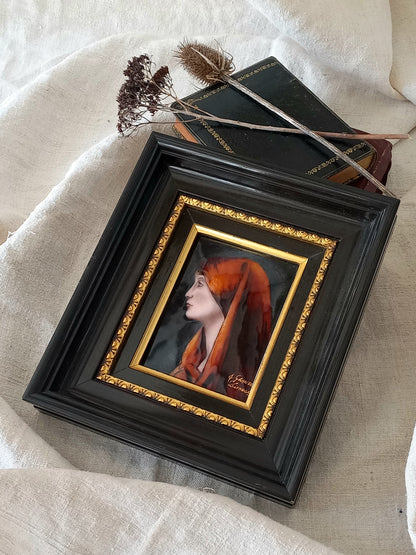A French vintage religious enamel Saint Fabiola portrait painting by Limoges of France. The religious figure has been hand-painted in enamels on copper and signed by the artist. The art is presented in a dark brown frame with a label to the rear that tells us it's a genuine hand-made enamel artwork.