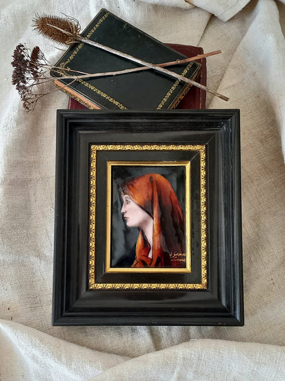 A French vintage religious enamel Saint Fabiola portrait painting by Limoges of France. The religious figure has been hand-painted in enamels on copper and signed by the artist. The art is presented in a dark brown frame with a label to the rear that tells us it's a genuine hand-made enamel artwork.