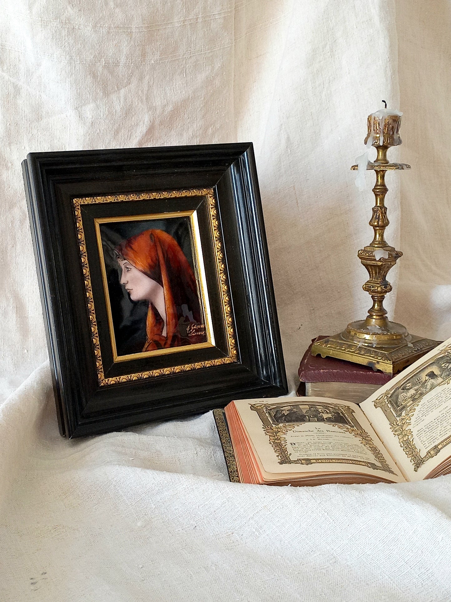A French vintage religious enamel Saint Fabiola portrait painting by Limoges of France. The religious figure has been hand-painted in enamels on copper and signed by the artist. The art is presented in a dark brown frame with a label to the rear that tells us it's a genuine hand-made enamel artwork.
