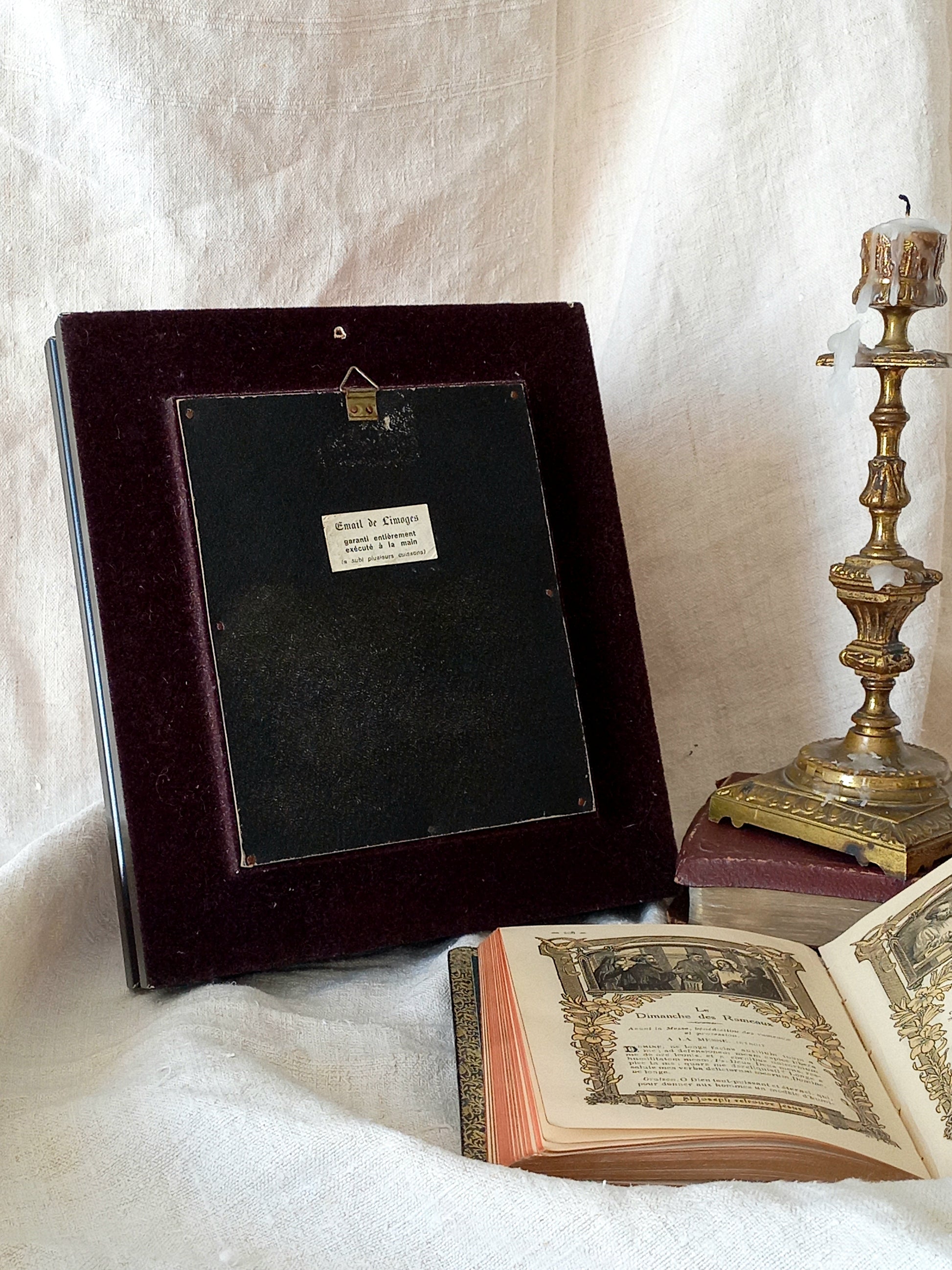 A French vintage religious enamel Saint Fabiola portrait painting by Limoges of France. The religious figure has been hand-painted in enamels on copper and signed by the artist. The art is presented in a dark brown frame with a label to the rear that tells us it's a genuine hand-made enamel artwork.