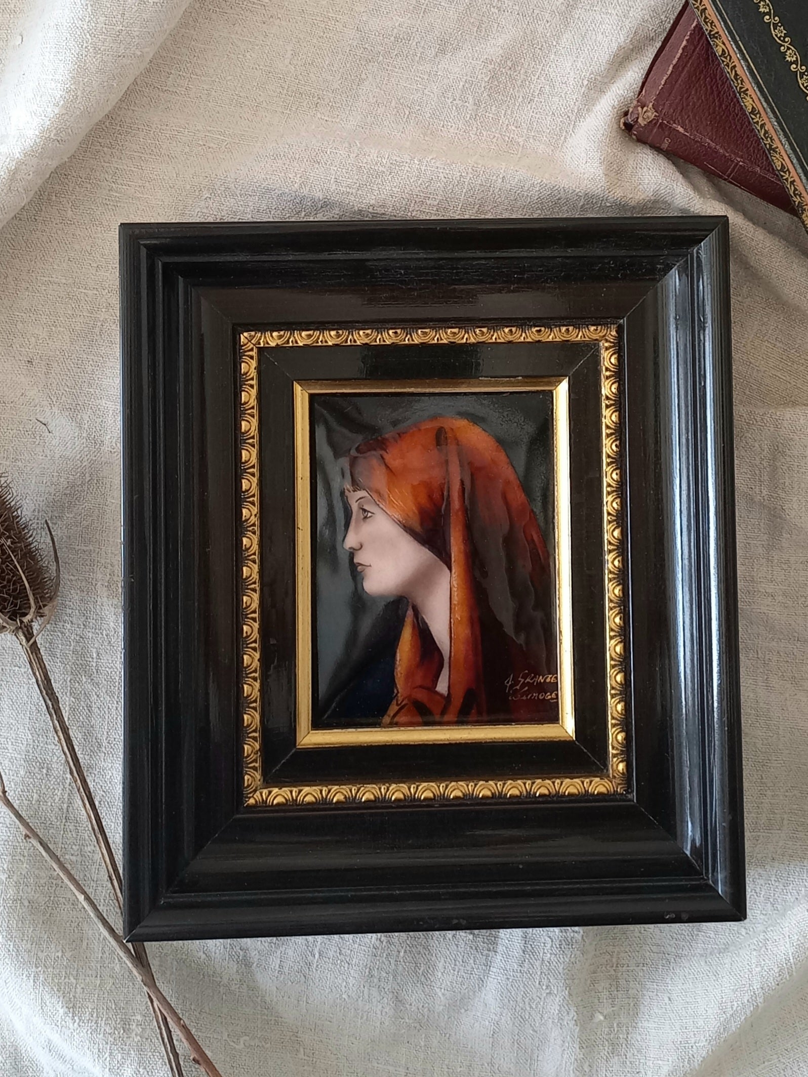 A French vintage religious enamel Saint Fabiola portrait painting by Limoges of France. The religious figure has been hand-painted in enamels on copper and signed by the artist. The art is presented in a dark brown frame with a label to the rear that tells us it's a genuine hand-made enamel artwork.