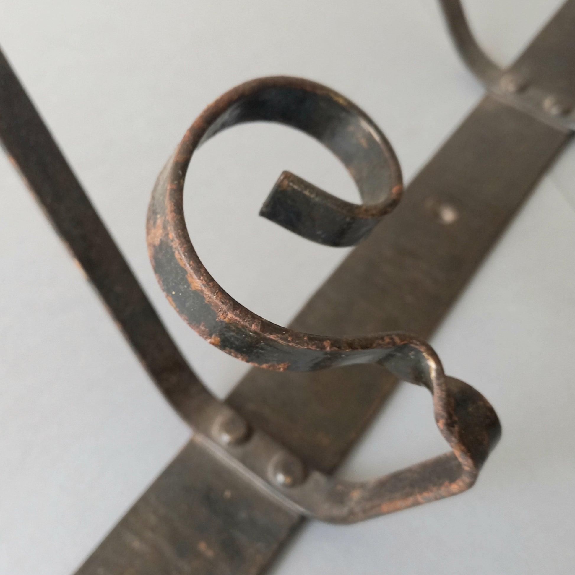 A large French vintage metal coat and hat rack for 4 coats and hats, a hand-made piece that is sturdy and can be screwed directly to your wall using the holes already in the wall bracket. The colour of the coat rack is a pleasing worn satin black with traces of gold showing through in places which give it a nice aged appearance.