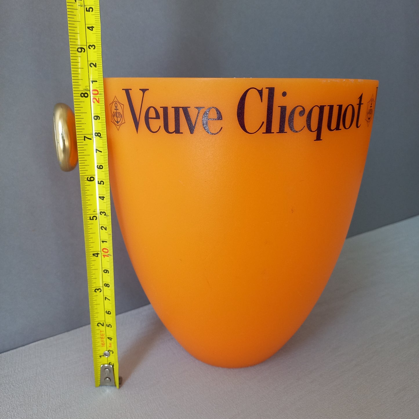 A French vintage Veuve Clicquot thick plastic champagne cooler in a wonderful shade of vibrant yellow-orange. Veuve Clicquot are from Reims, France (founded in 1772) and is one of the premier champagne manufacturers in the world so this piece will serve as a nice practical collectible.