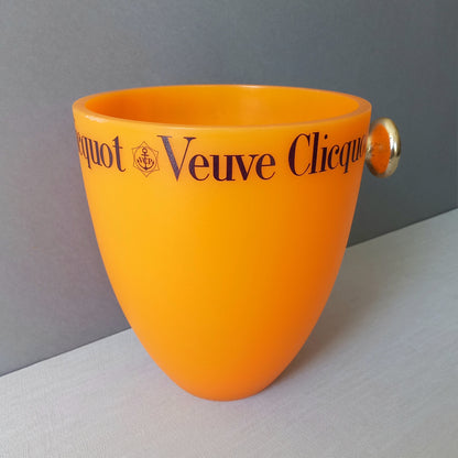 A French vintage Veuve Clicquot thick plastic champagne cooler in a wonderful shade of vibrant yellow-orange. Veuve Clicquot are from Reims, France (founded in 1772) and is one of the premier champagne manufacturers in the world so this piece will serve as a nice practical collectible.