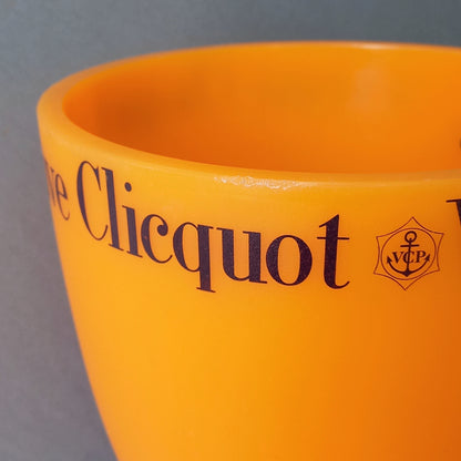 A French vintage Veuve Clicquot thick plastic champagne cooler in a wonderful shade of vibrant yellow-orange. Veuve Clicquot are from Reims, France (founded in 1772) and is one of the premier champagne manufacturers in the world so this piece will serve as a nice practical collectible.