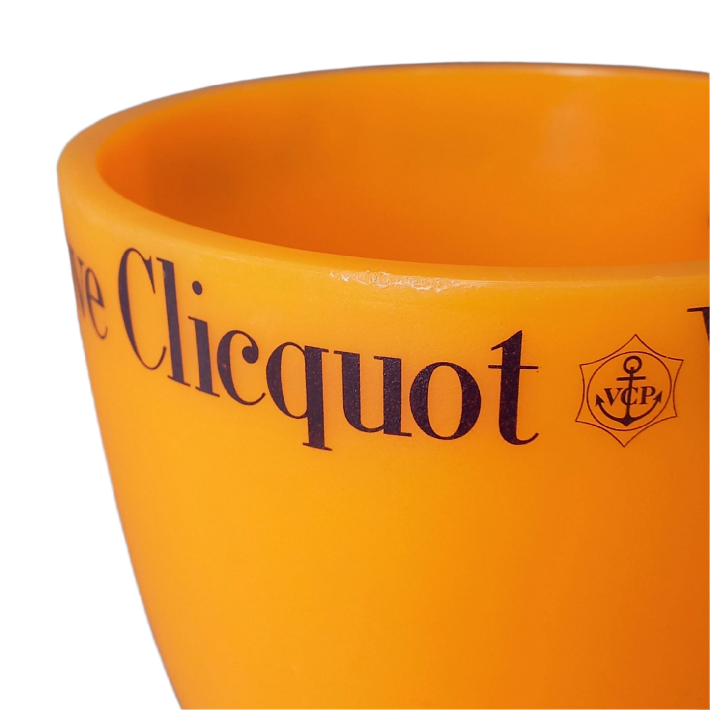 A French vintage Veuve Clicquot thick plastic champagne cooler in a wonderful shade of vibrant yellow-orange. Veuve Clicquot are from Reims, France (founded in 1772) and is one of the premier champagne manufacturers in the world so this piece will serve as a nice practical collectible.