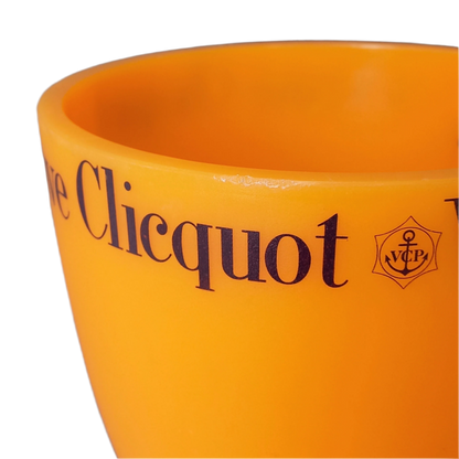 A French vintage Veuve Clicquot thick plastic champagne cooler in a wonderful shade of vibrant yellow-orange. Veuve Clicquot are from Reims, France (founded in 1772) and is one of the premier champagne manufacturers in the world so this piece will serve as a nice practical collectible.