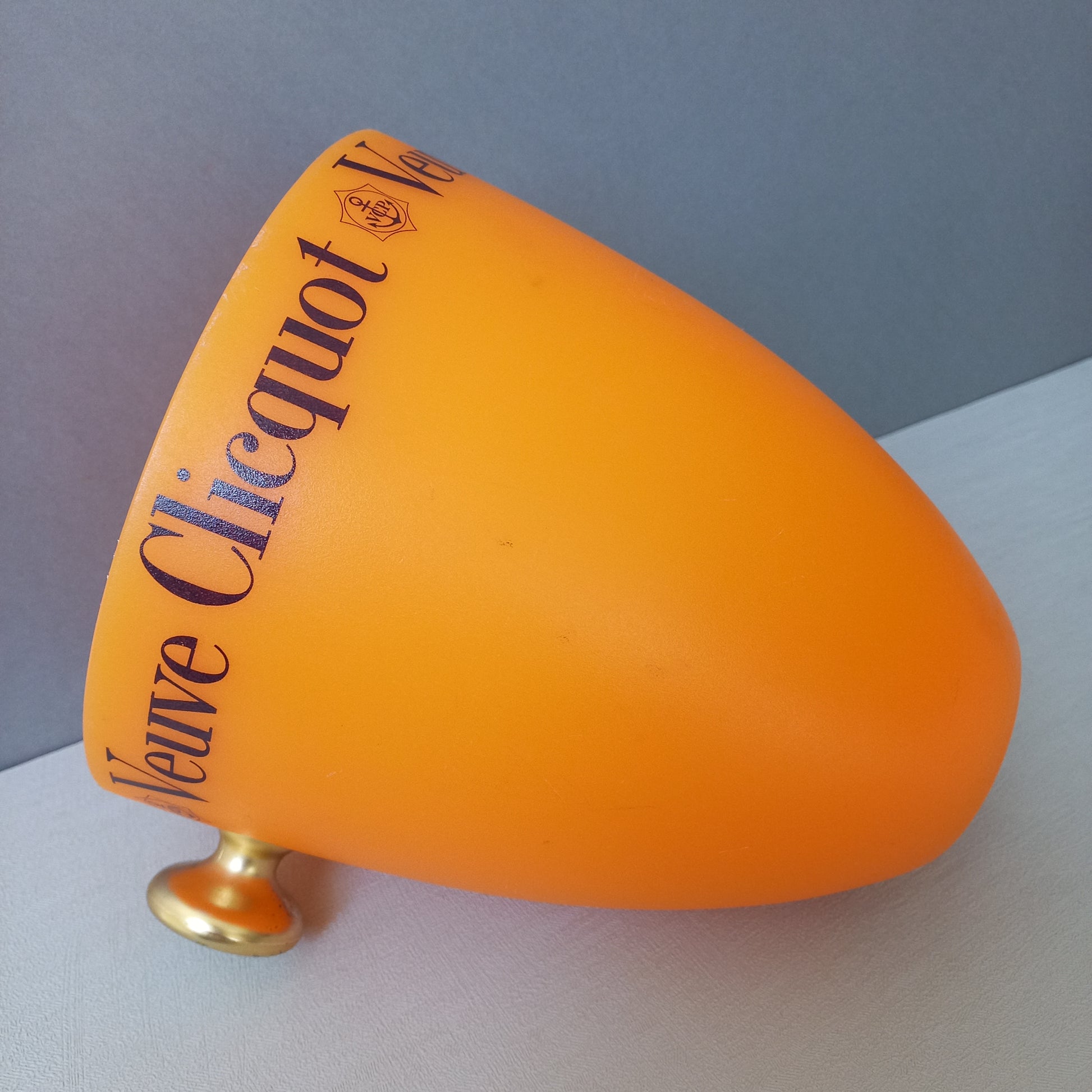 A French vintage Veuve Clicquot thick plastic champagne cooler in a wonderful shade of vibrant yellow-orange. Veuve Clicquot are from Reims, France (founded in 1772) and is one of the premier champagne manufacturers in the world so this piece will serve as a nice practical collectible.
