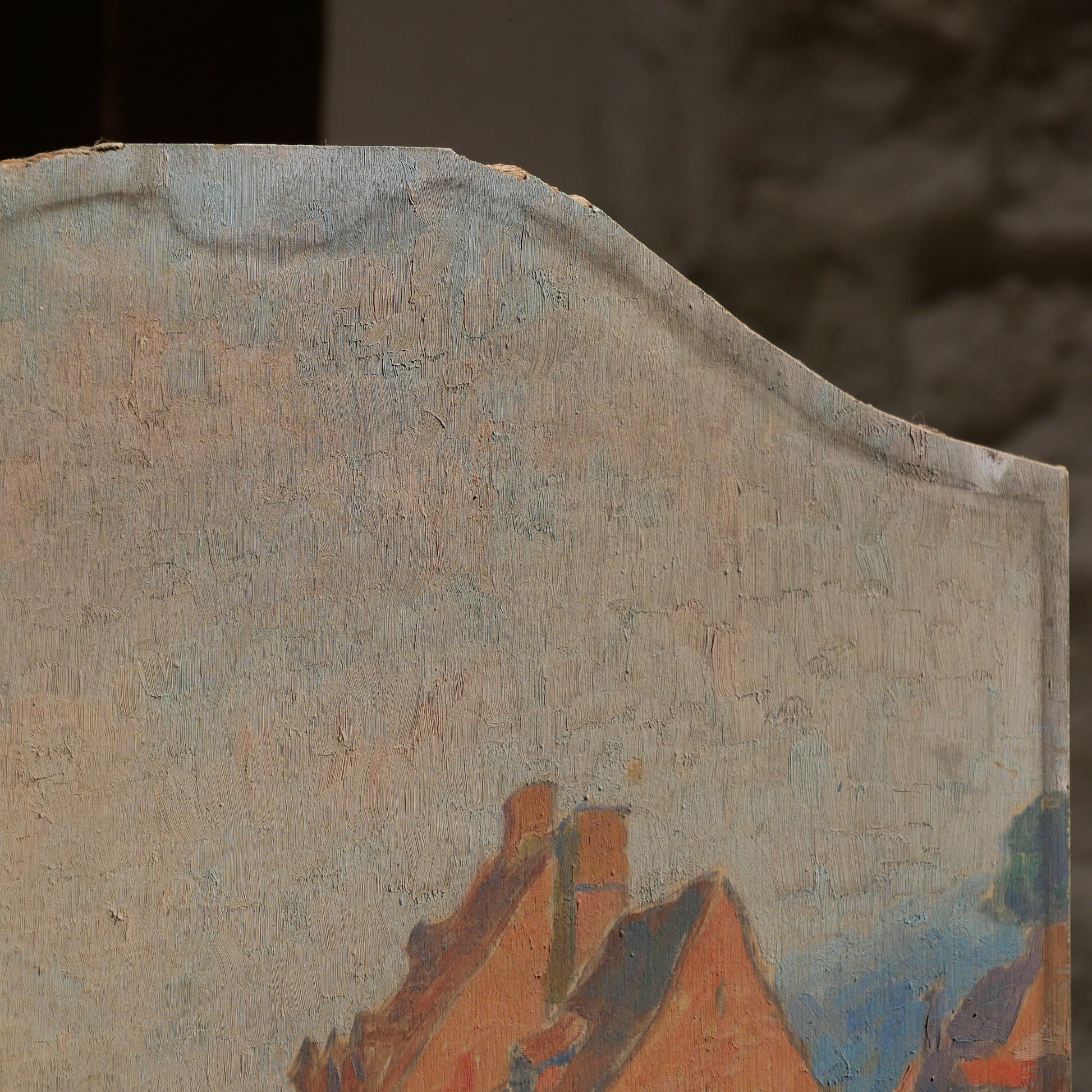 An original vintage oil painting depicting a village on the banks of a large river. It looks similar to the Rhine River Danube in Germany, and with the large hills/mountains in the background maybe the Black Forest, although it could be many places in Europe and perhaps even in France where we purchased this wonderful piece of original art on wooden board.