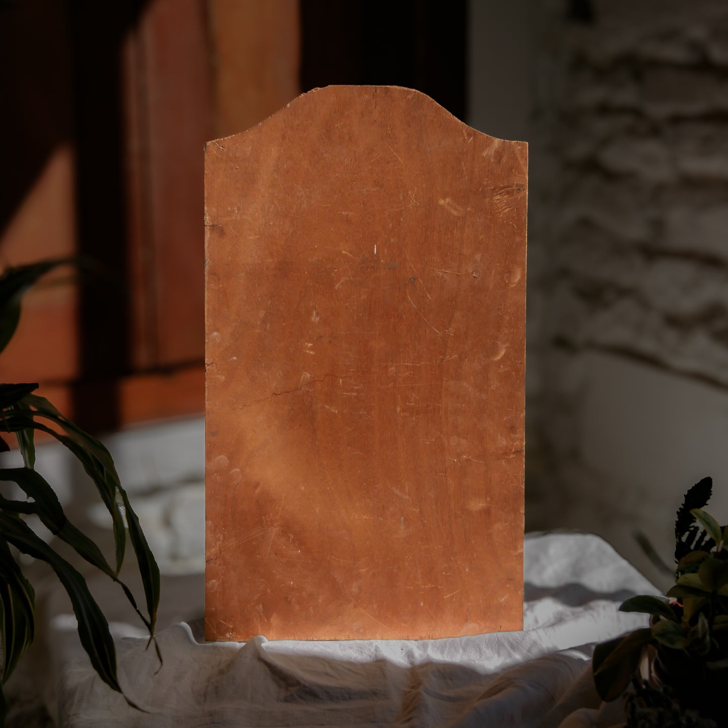 An original vintage oil painting depicting a village on the banks of a large river. It looks similar to the Rhine River Danube in Germany, and with the large hills/mountains in the background maybe the Black Forest, although it could be many places in Europe and perhaps even in France where we purchased this wonderful piece of original art on wooden board.