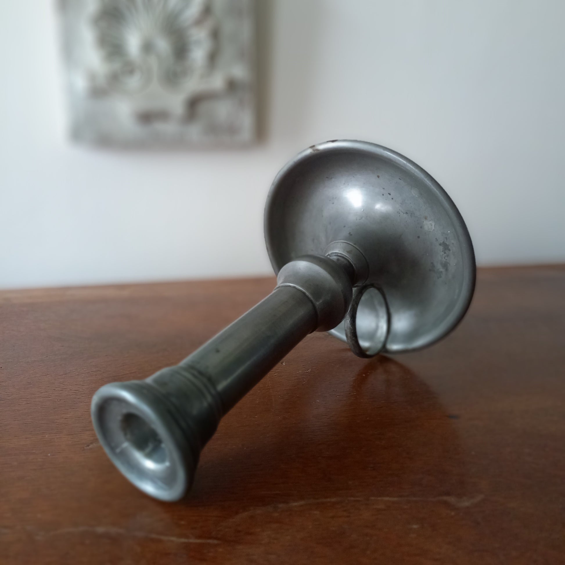 A handsome French vintage pewter candle holder / chamber stick that makes excellent home decor. This chamber stick is taller than similar ones we usually find. Underneath is marked with the manufacturer's stamp - a great looking piece!