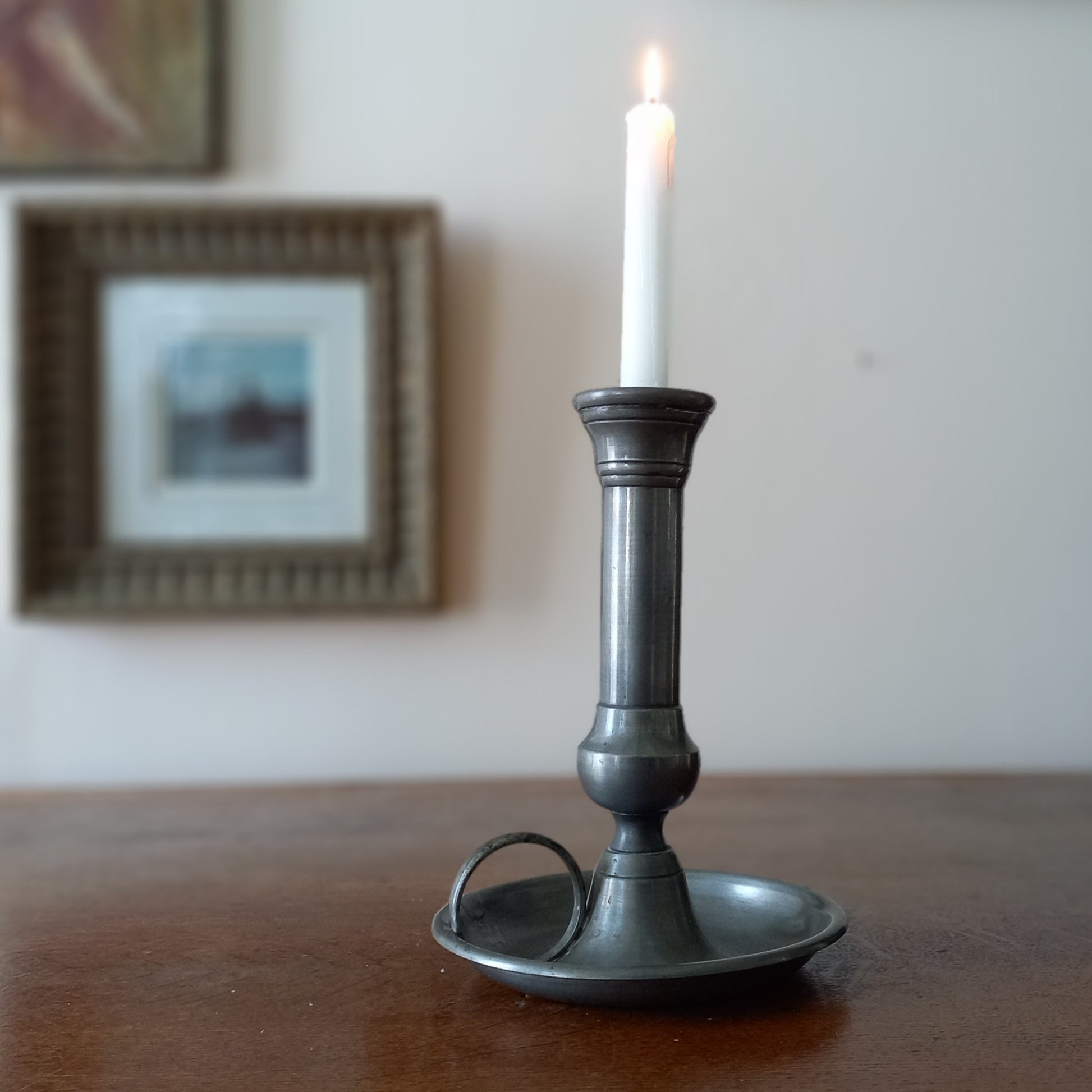 A handsome French vintage pewter candle holder / chamber stick that makes excellent home decor. This chamber stick is taller than similar ones we usually find. Underneath is marked with the manufacturer's stamp - a great looking piece!