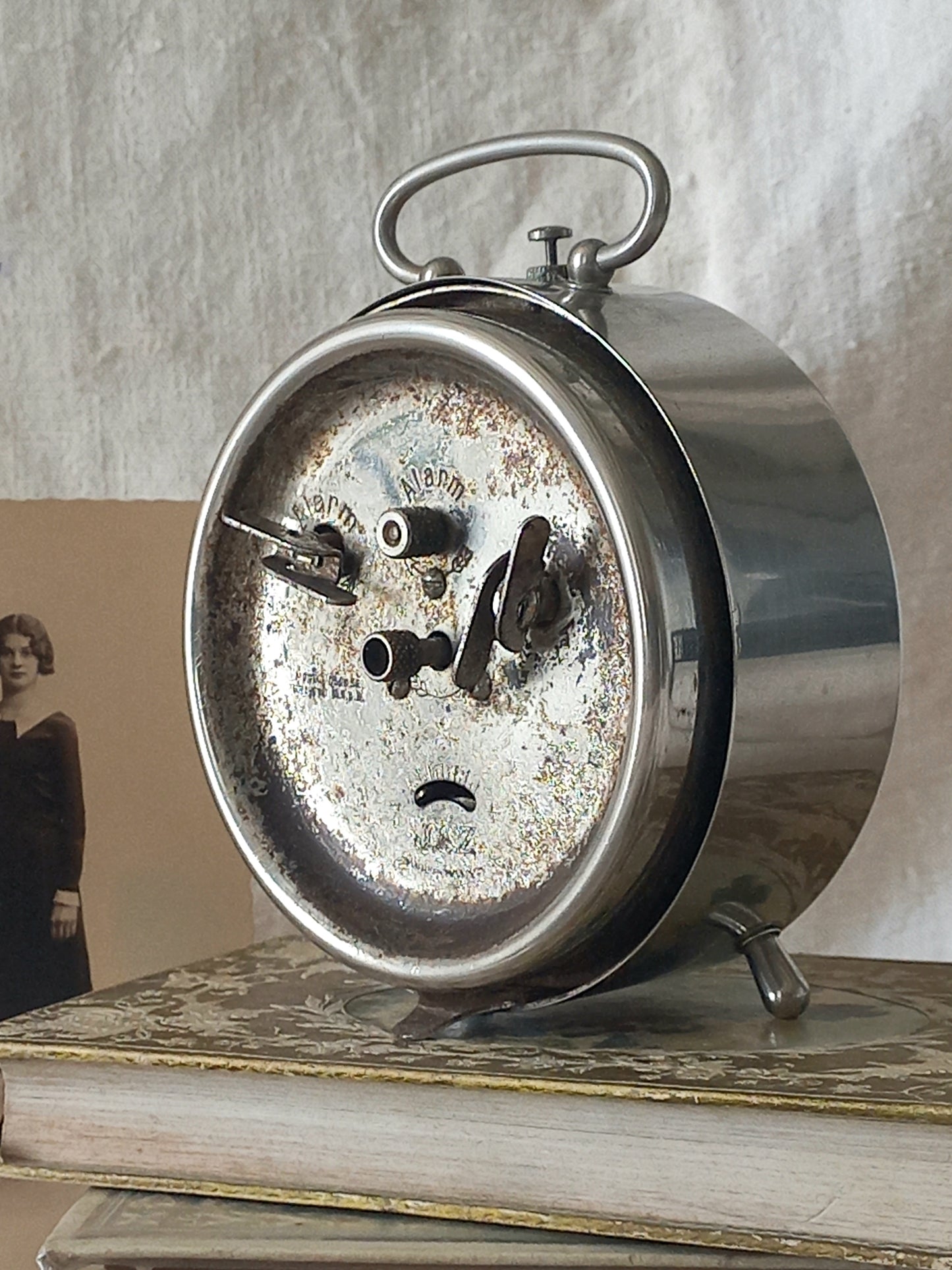 Original vintage Jaz alarm clock on books with a rustic background