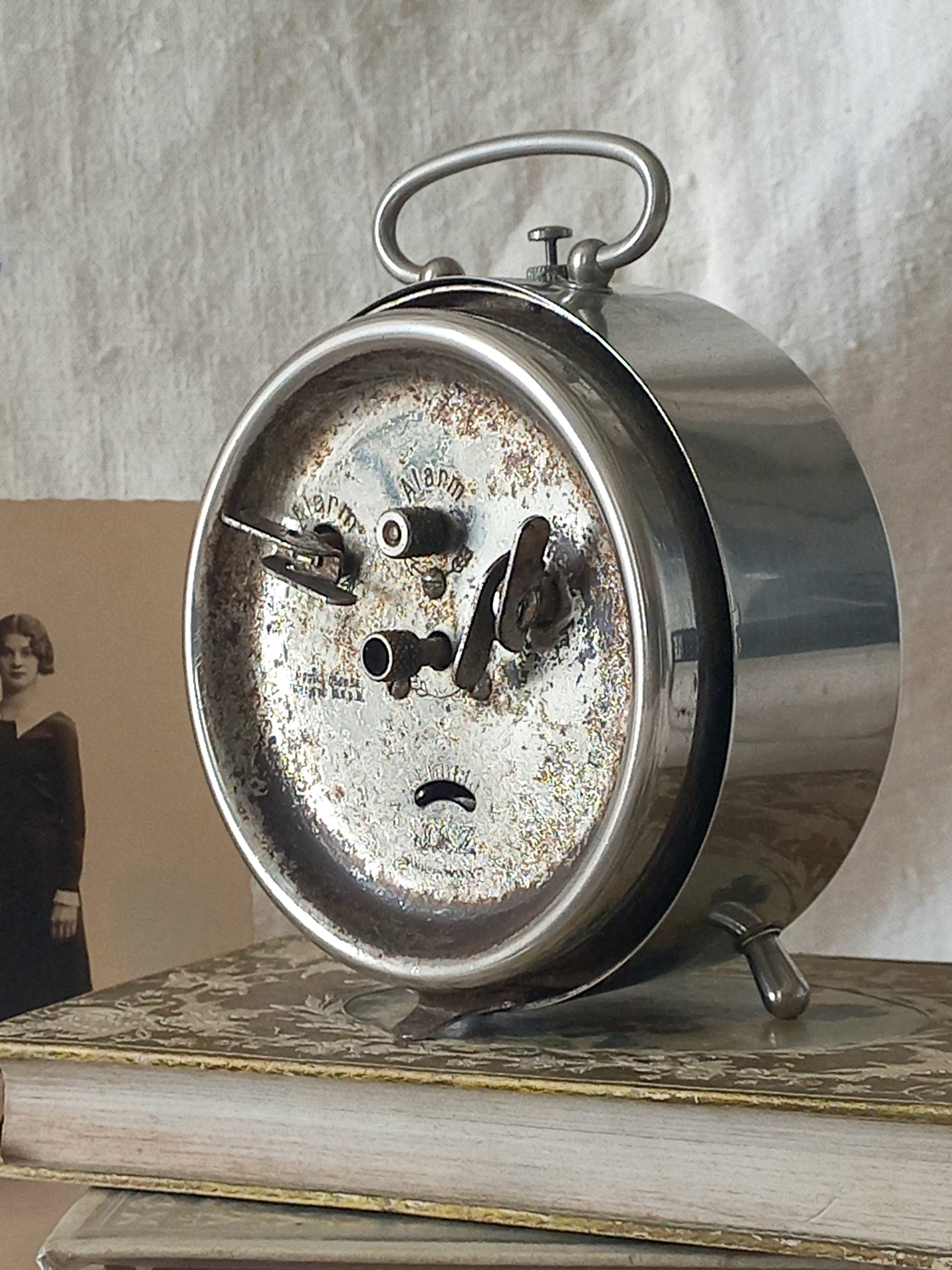 Original vintage Jaz alarm clock on books with a rustic background