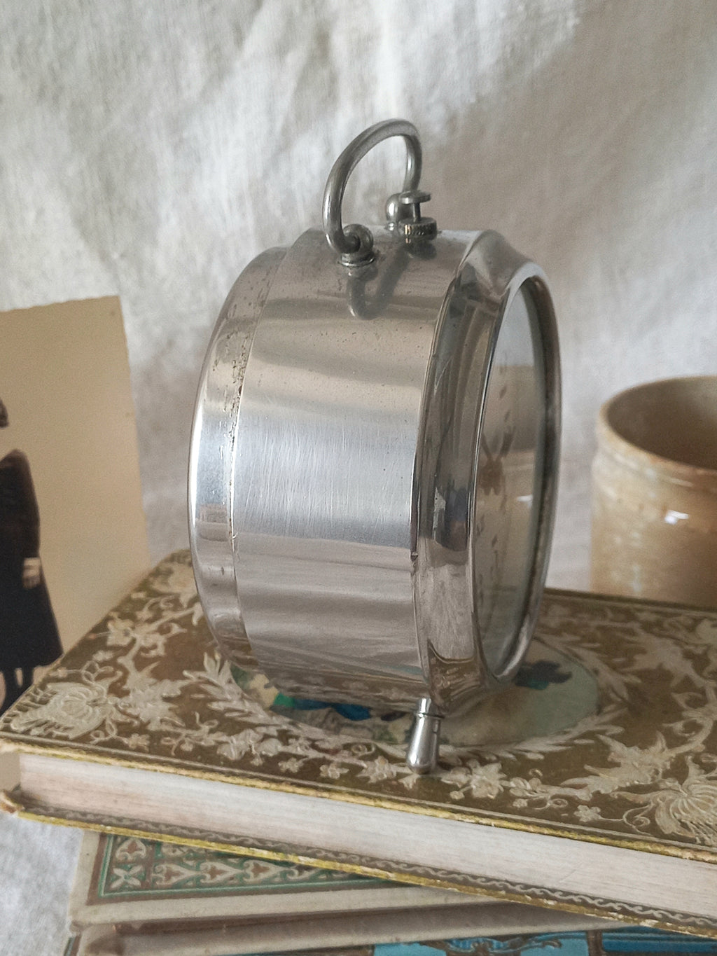 Original vintage Jaz alarm clock on books with a rustic background