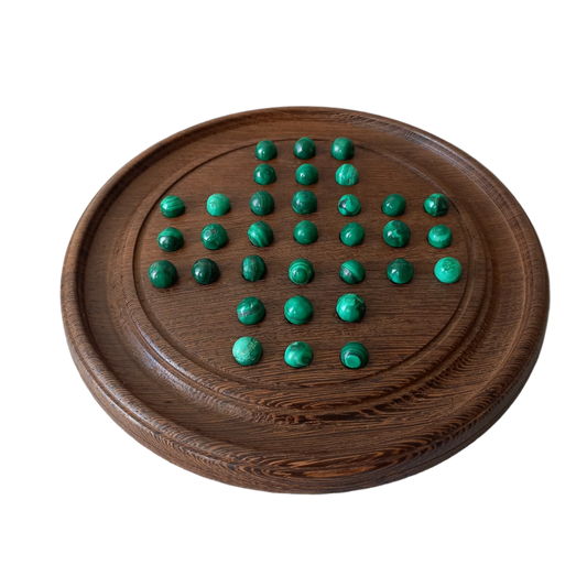 Handmade wooden solitaire board with semi-precious malachite marbles