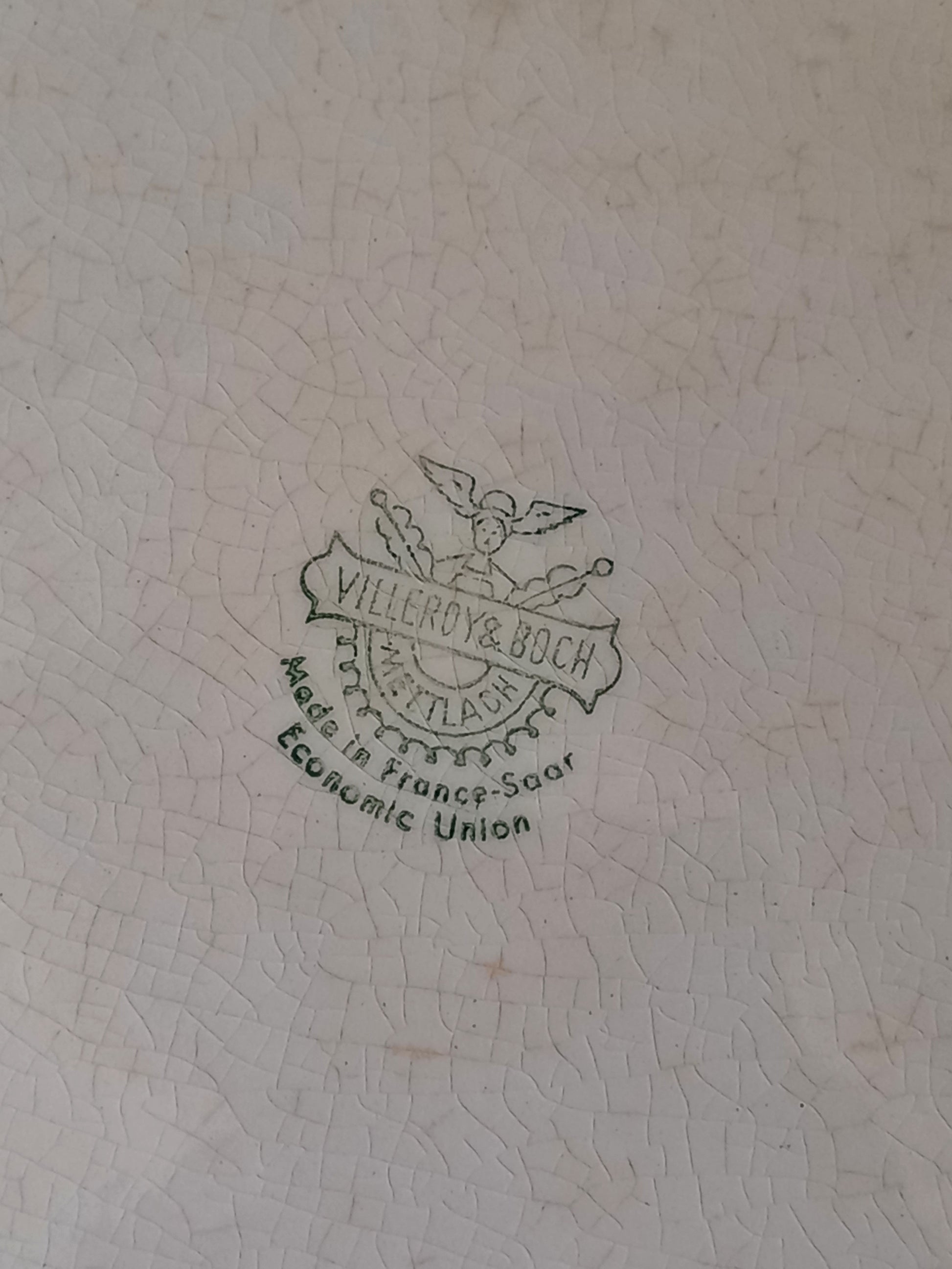 A beautiful vintage oval ironstone serving plate with decorative edges in a time-worn creamy white with super tea-staining that gives it that shabby chic finish many of us desire.