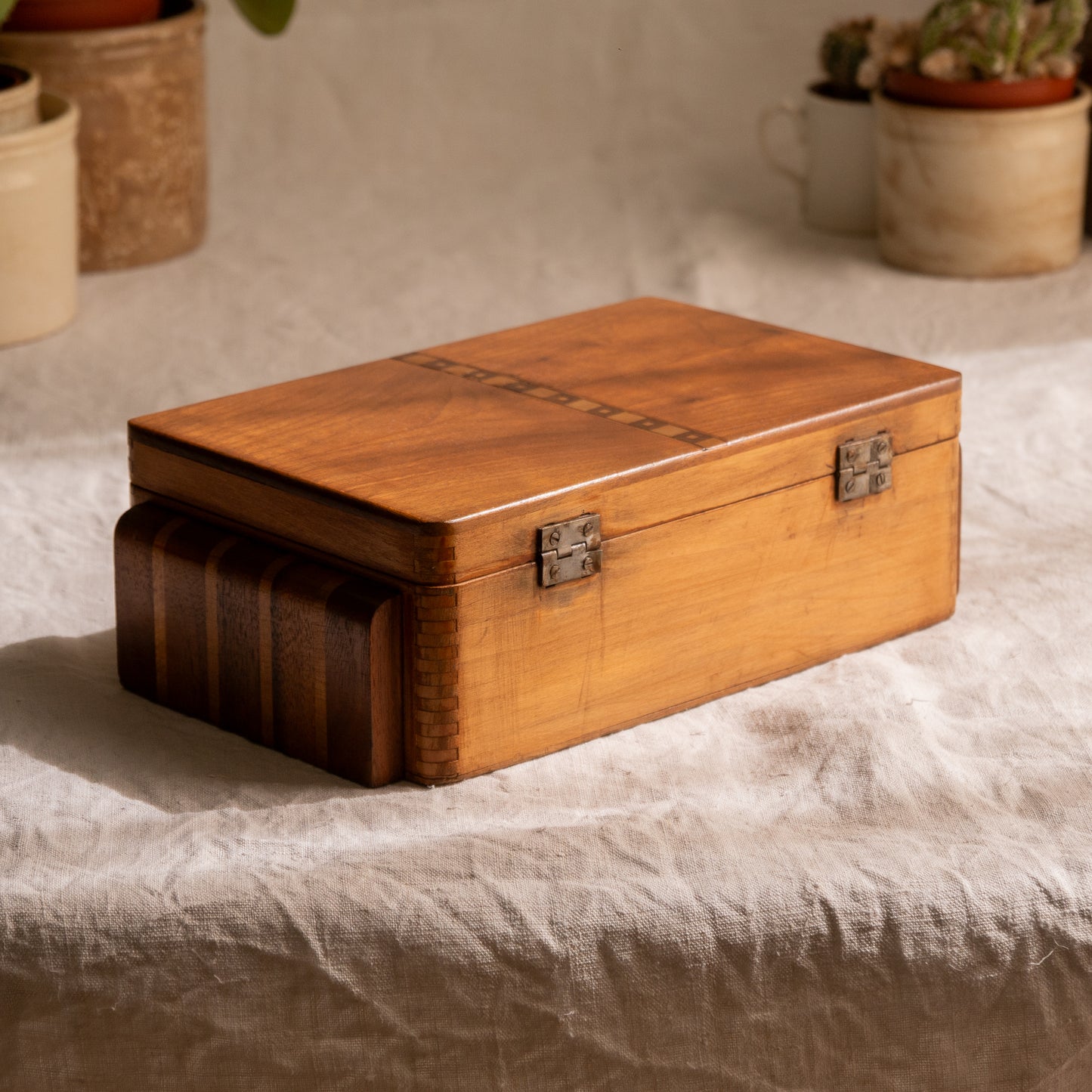 A beautiful French vintage wooden box, a hand-made piece with dove-tailed joints and inlaid design pattern - the colour of the wood is a wonderful golden brown and the hinges are strong. In summary a beautiful vintage box which makes an attractive piece of practical home decor.
