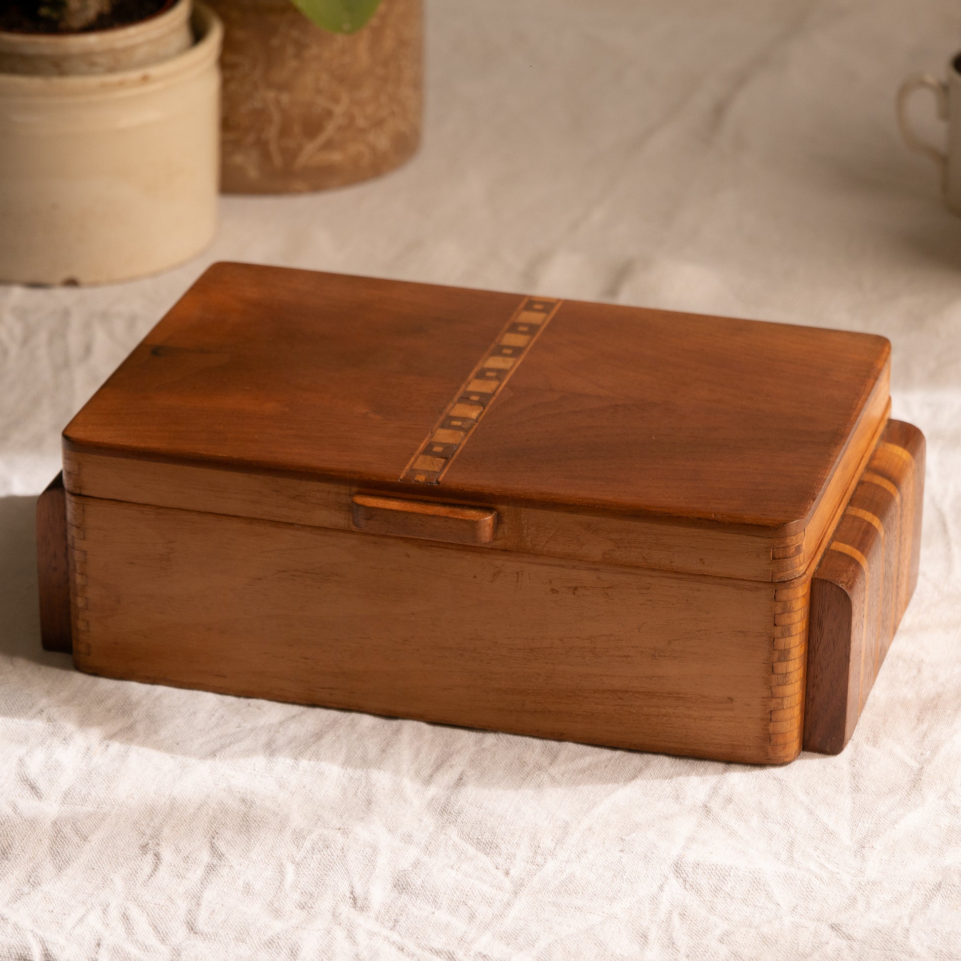 A beautiful French vintage wooden box, a hand-made piece with dove-tailed joints and inlaid design pattern - the colour of the wood is a wonderful golden brown and the hinges are strong. In summary a beautiful vintage box which makes an attractive piece of practical home decor.