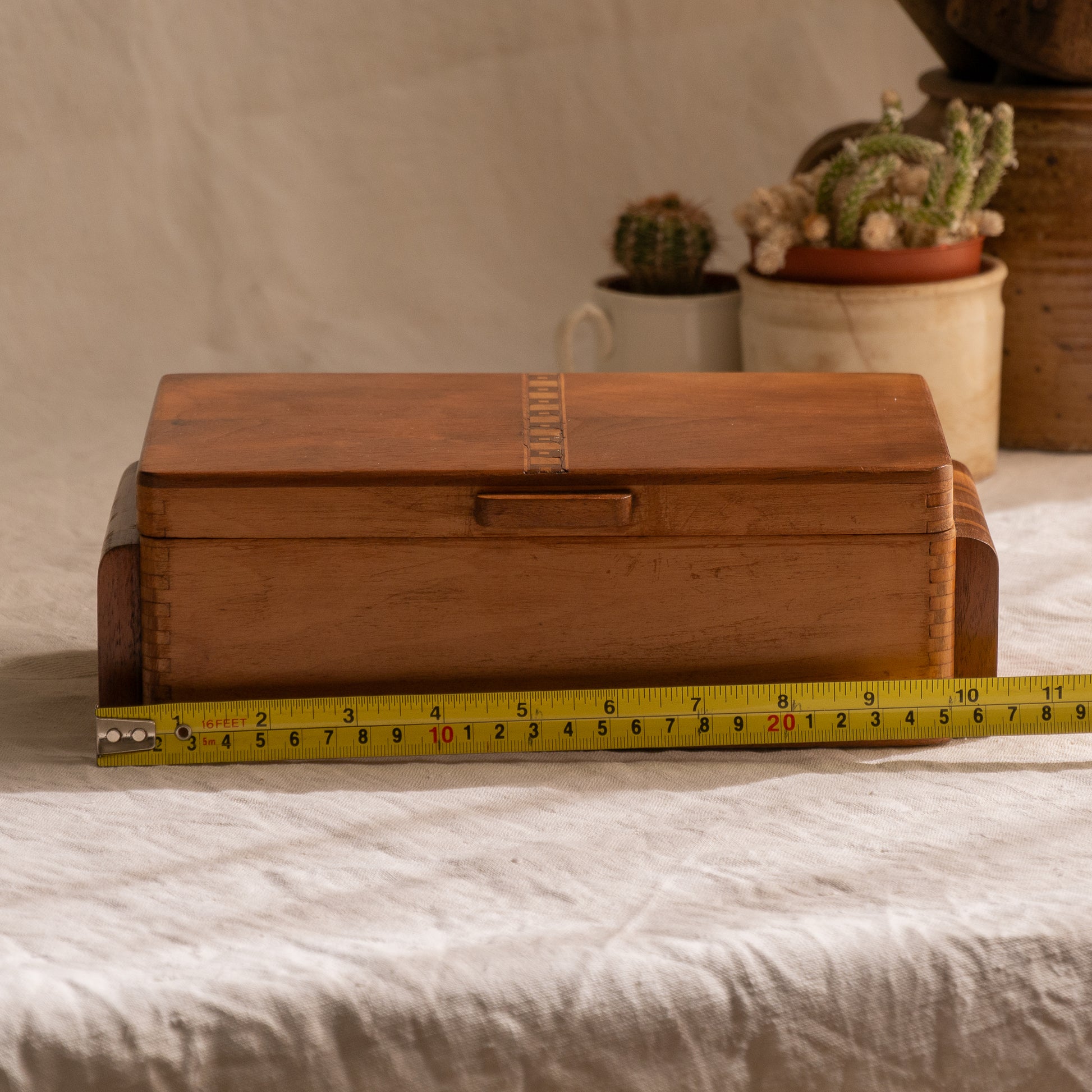 A beautiful French vintage wooden box, a hand-made piece with dove-tailed joints and inlaid design pattern - the colour of the wood is a wonderful golden brown and the hinges are strong. In summary a beautiful vintage box which makes an attractive piece of practical home decor.