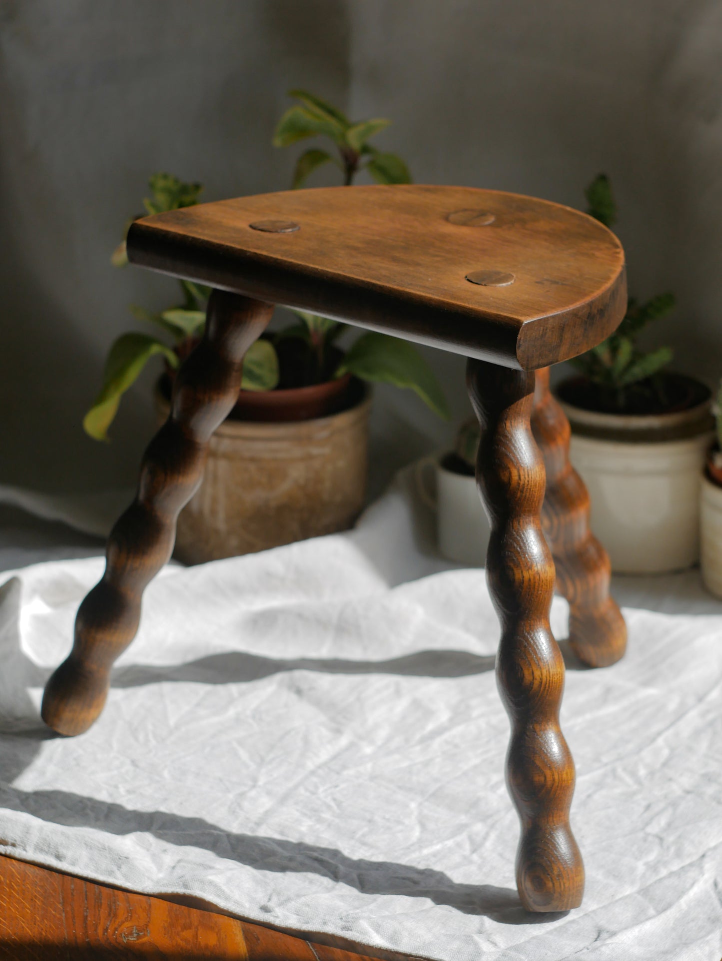 French vintage wooden stool with three turned wooden legs