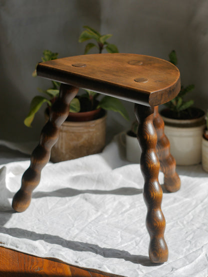 French vintage wooden stool with three turned wooden legs