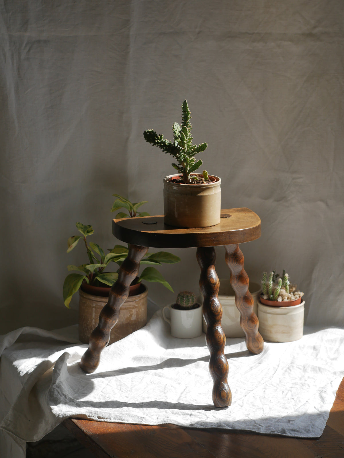 French vintage wooden stool with three turned wooden legs