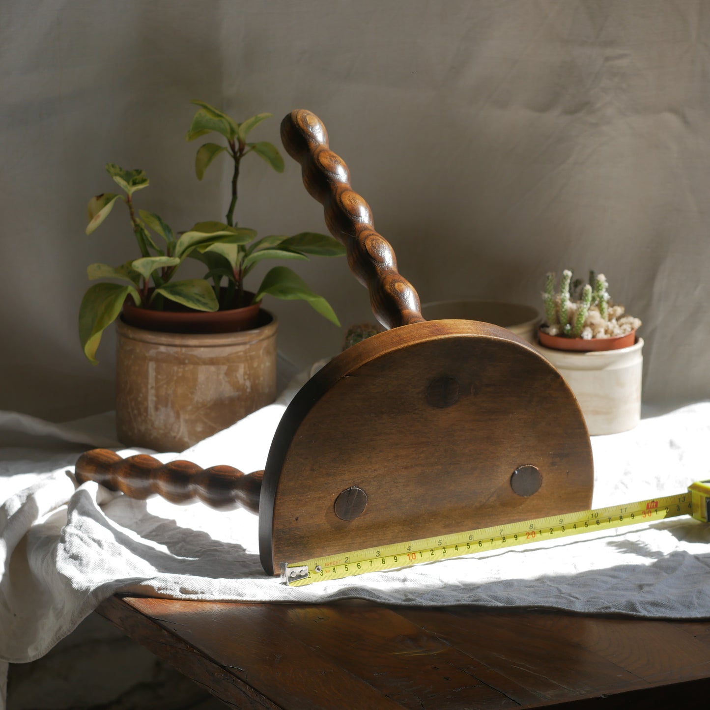 French vintage wooden stool with three turned wooden legs