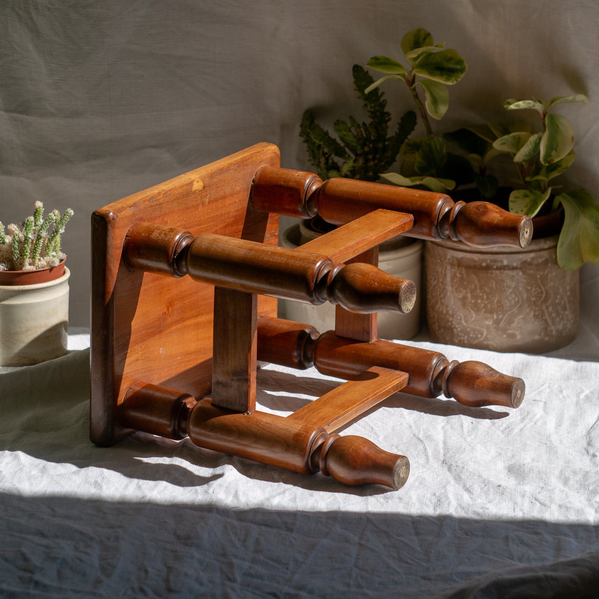 A handsome vintage French wooden stool in a lovely shade of honey-coloured brown. This old stool is very solid and would make a great plant stand (we currently use one on our desk as a plant stand and it looks great!) and many other decorative possibilities.