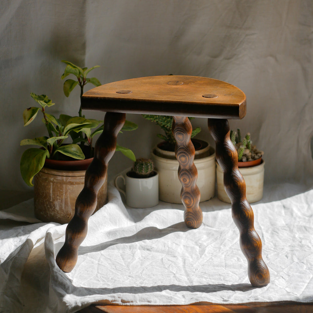 French vintage wooden stool with three turned wooden legs