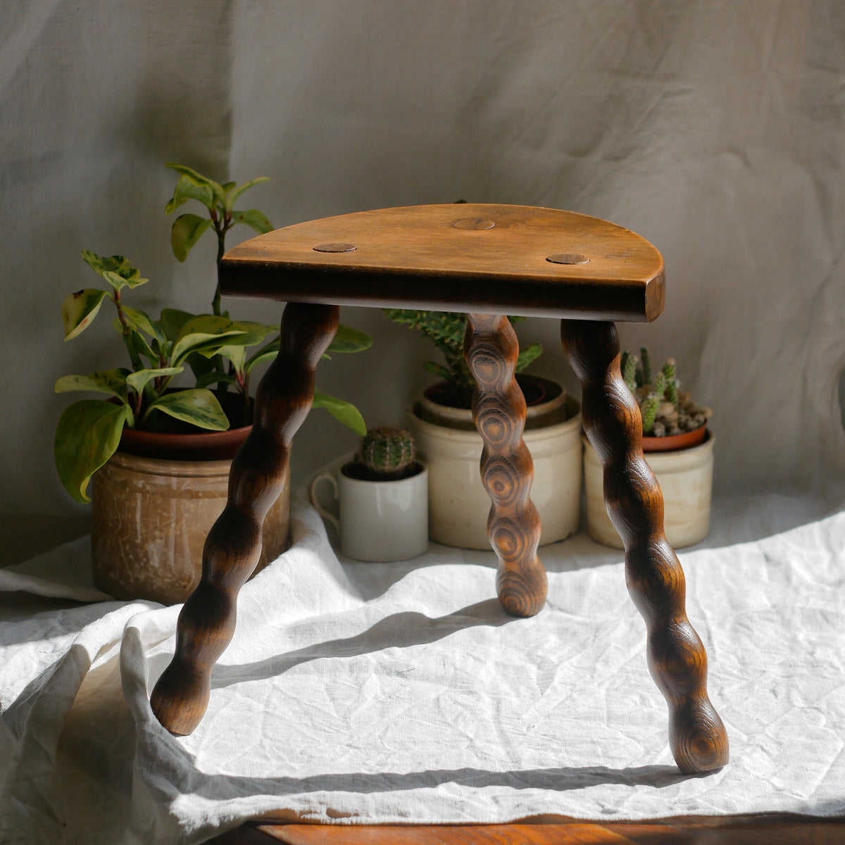French vintage wooden stool with three turned wooden legs