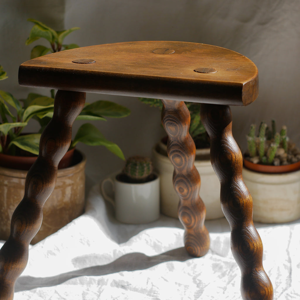 French vintage wooden stool with three turned wooden legs